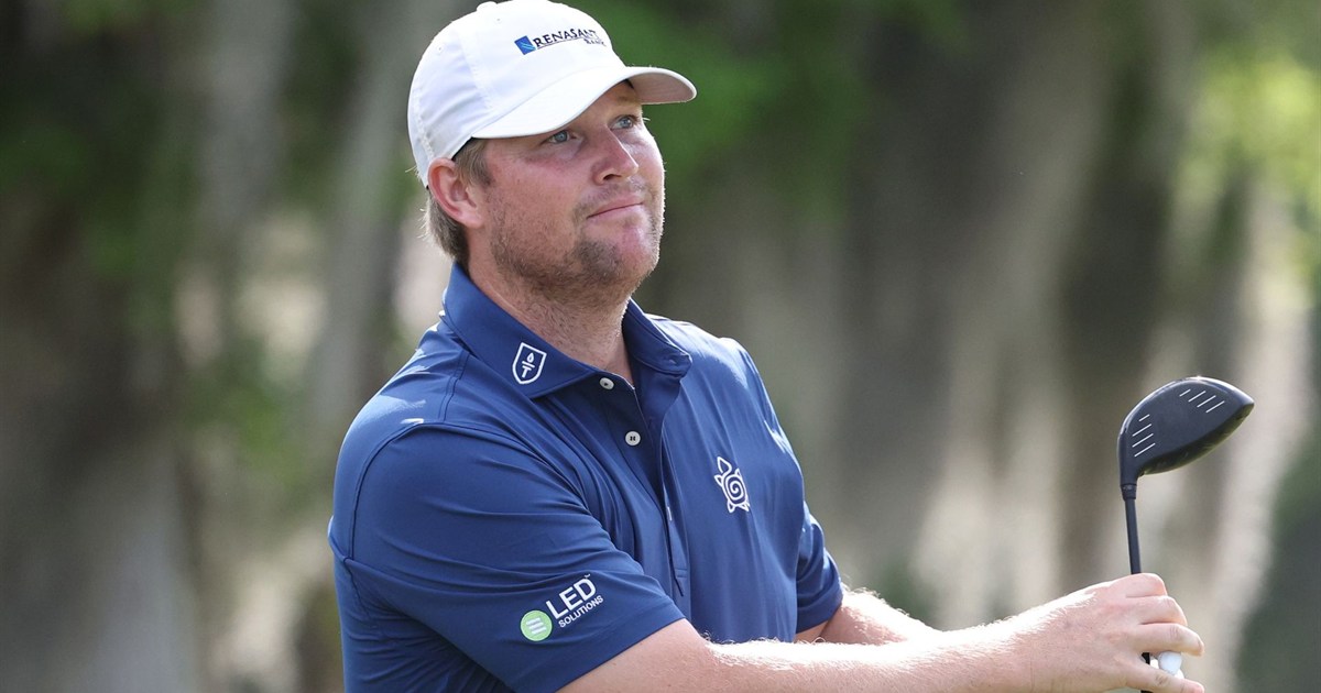 Trey Mullinax watches a golf shot while holding his driver